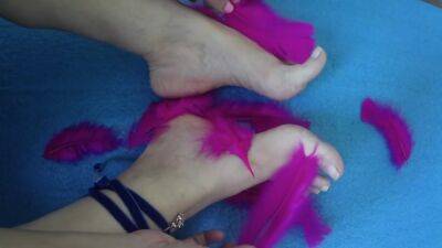 Mature Woman Puts Her Feet On Fire Rubbing Them With Soft Feathers - hclips.com